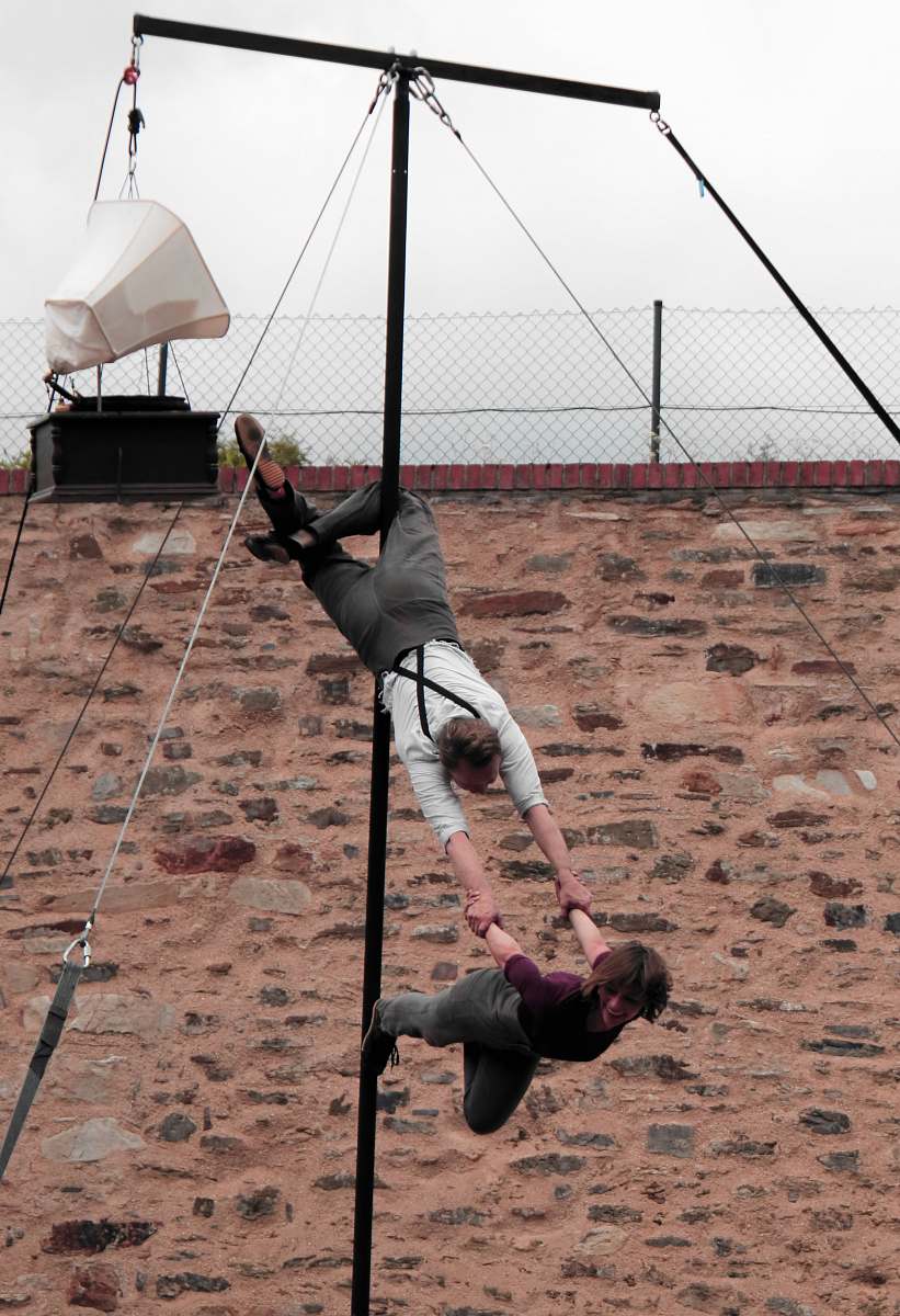 leisure activities man hanging on rod carrying woman adventure